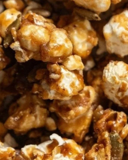 Close-up of caramel popcorn with visible nuts